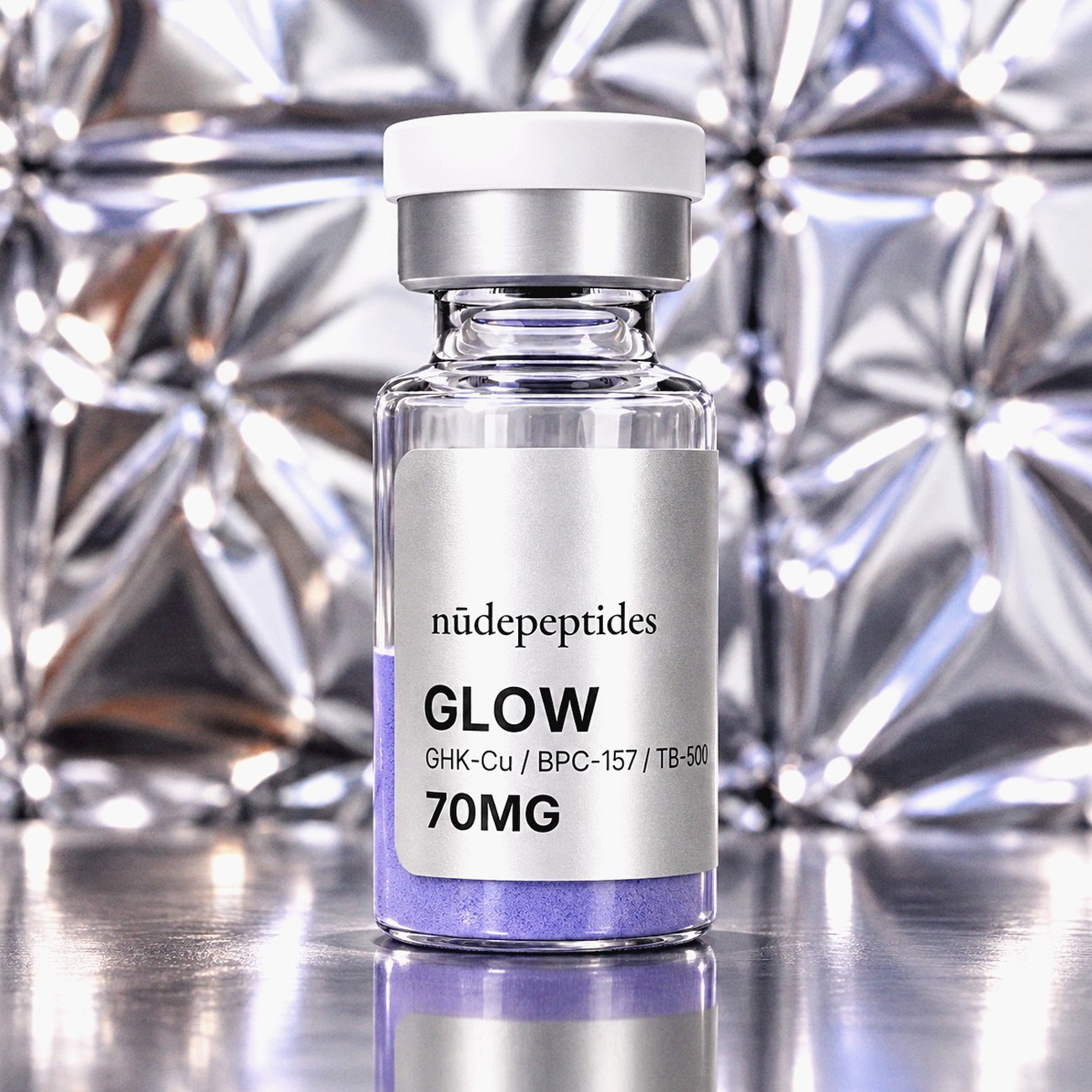 GLOW 70mg vial against embossed silver foil